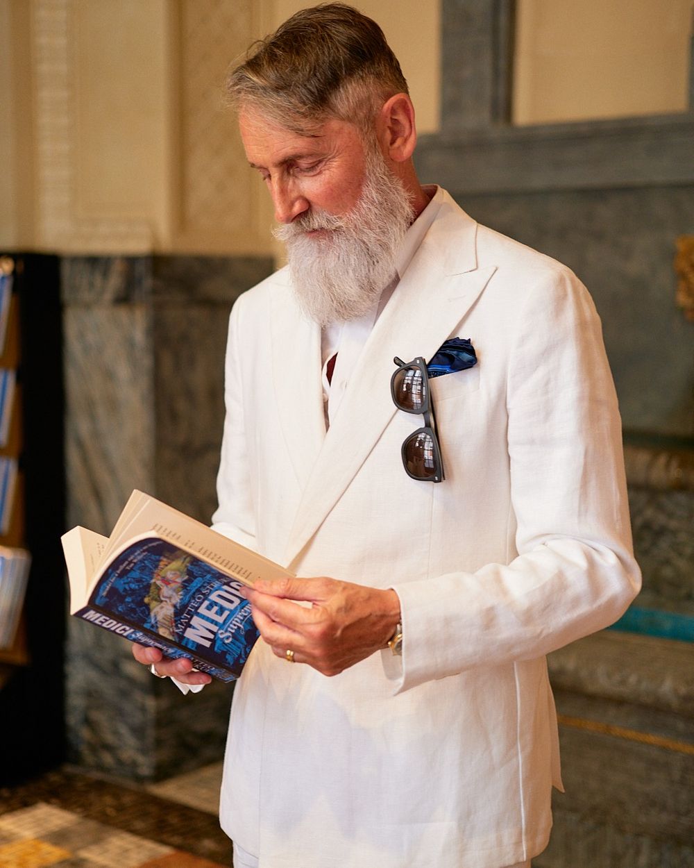 White Double-Breasted Suit with Blue Pocket Square