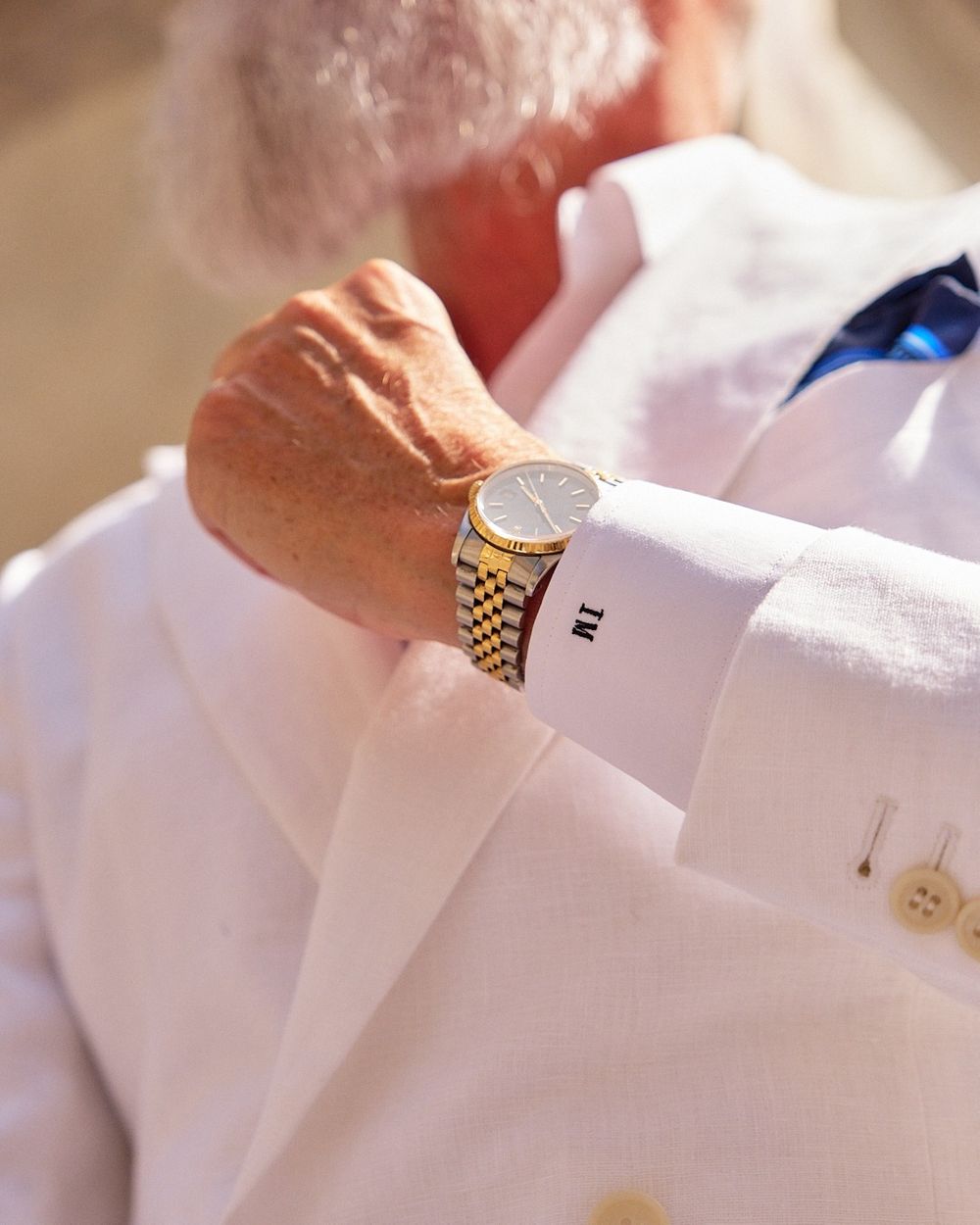 White Double-Breasted Suit with Blue Pocket Square