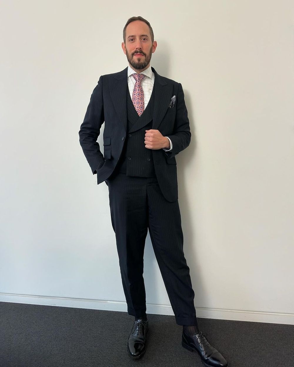 pinstripe suit with striped tie