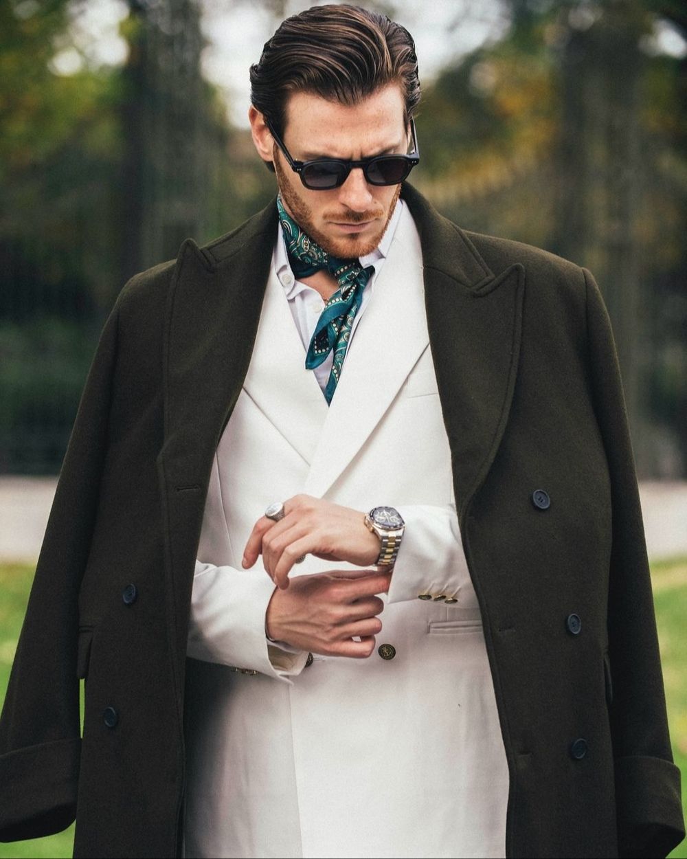 White Double-Breasted Suit with Olive Overcoat and Silk Scarf