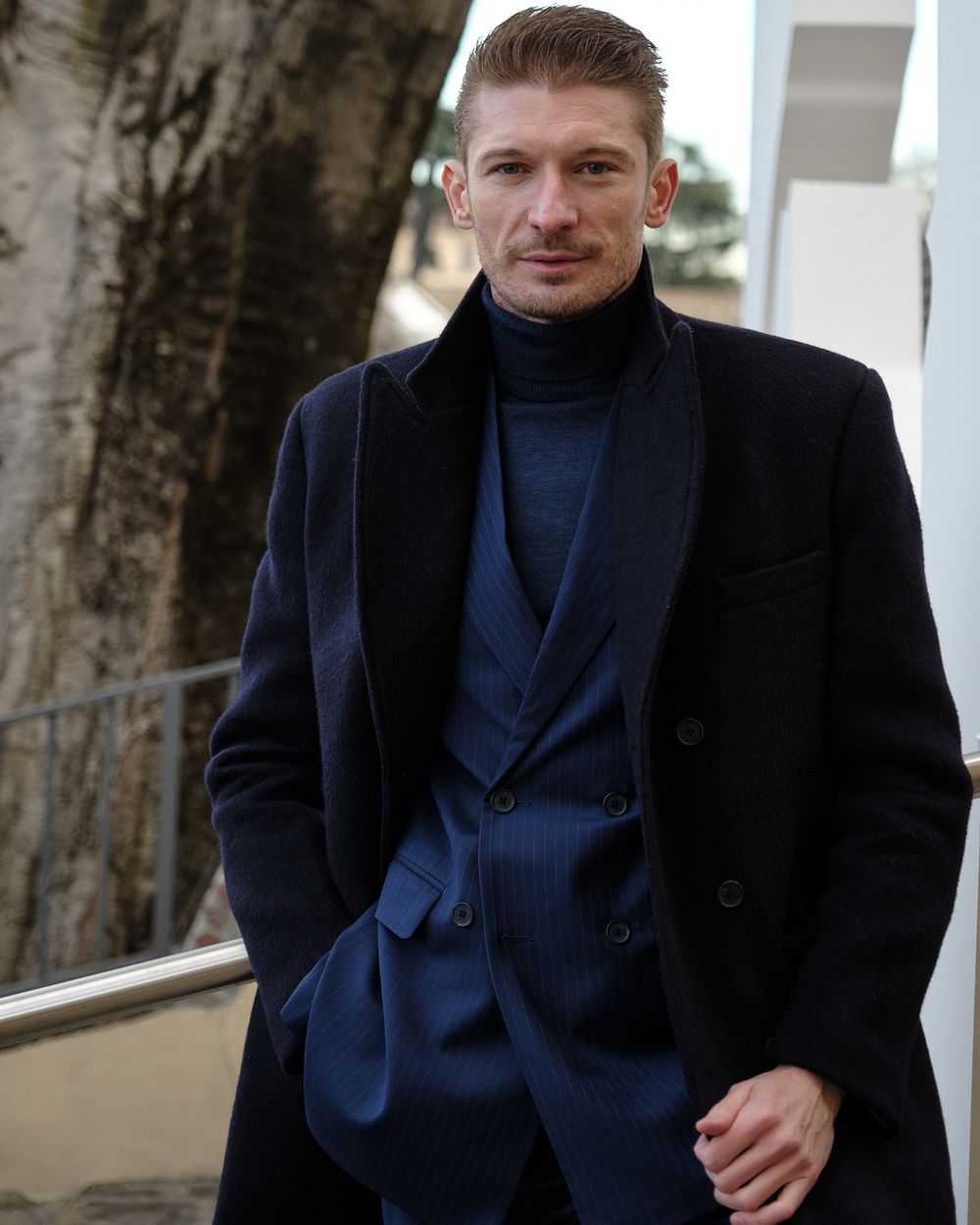 pinstripe suit with striped tie