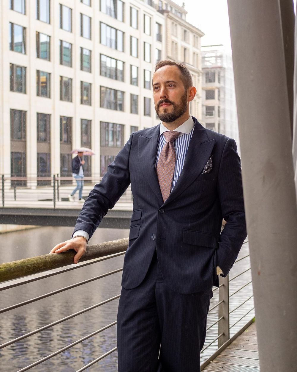 Navy Pinstripe Suit with Striped Shirt and Patterned Tie