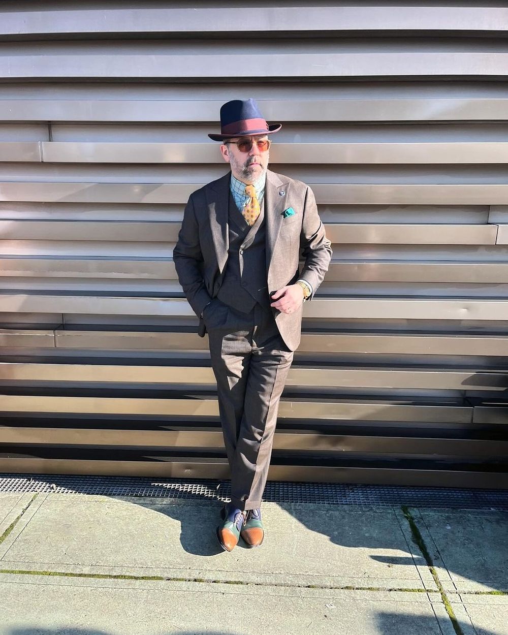 Brown Three-Piece Suit with Checkered Overcoat	