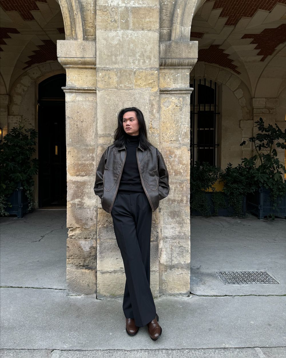 Brown Leather Jacket with Black Turtleneck and Trousers