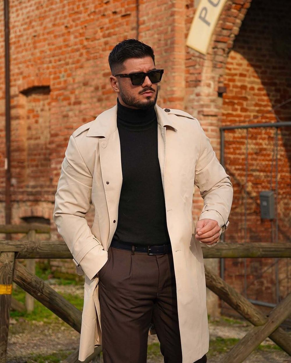 Beige Trench Coat with Black Turtleneck and Brown Trousers