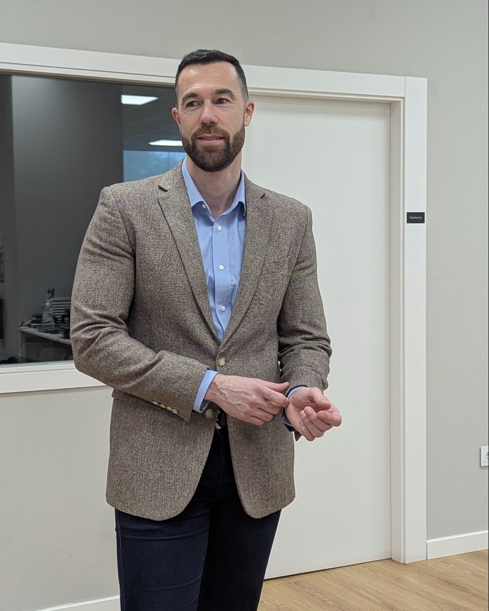 Brown Tweed Blazer with Light Blue Shirt, Dark Jeans, and Leather Boots