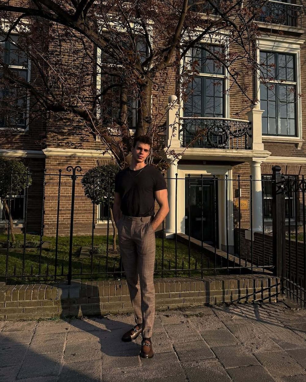 Black T-shirt with Checked Brown Trousers