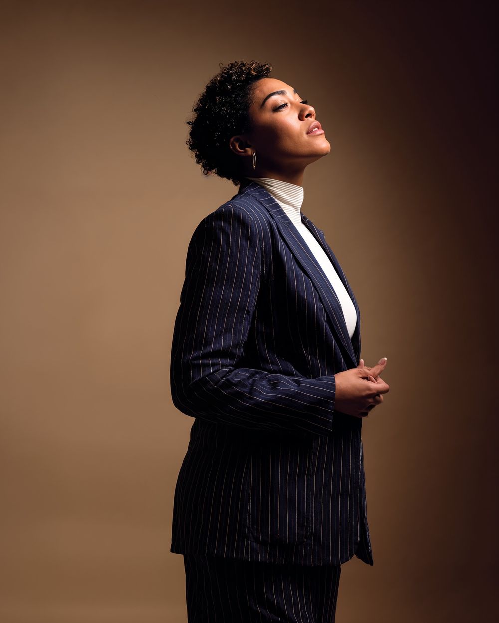 pinstripe suit with striped tie