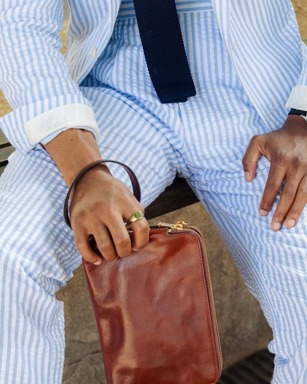 Blue and White Seersucker Suit with Navy Tie and Straw Hat