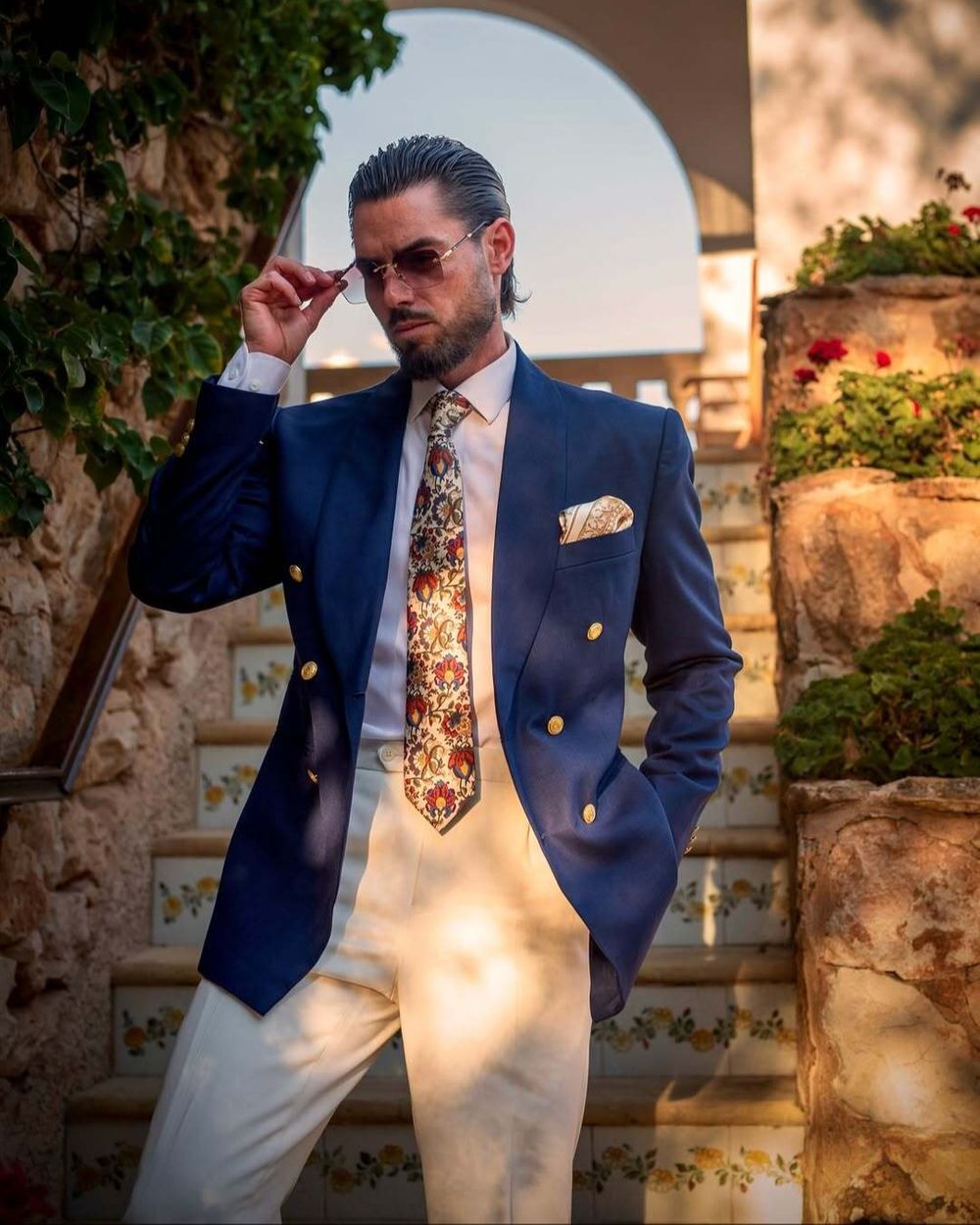 Navy Double-Breasted Blazer with Cream Trousers and Floral Tie