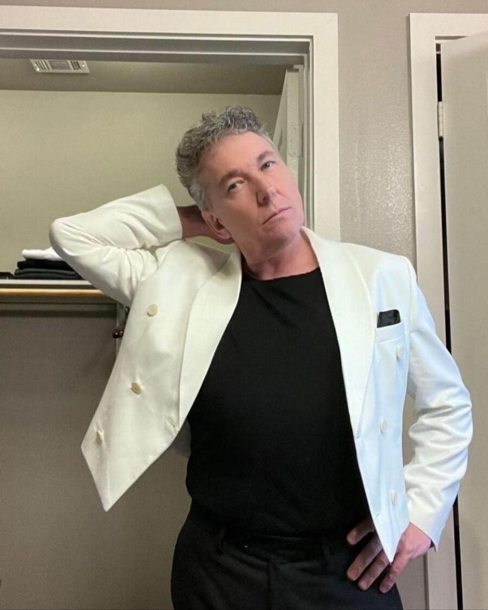 White Double-Breasted Blazer with Black T-Shirt and Trousers