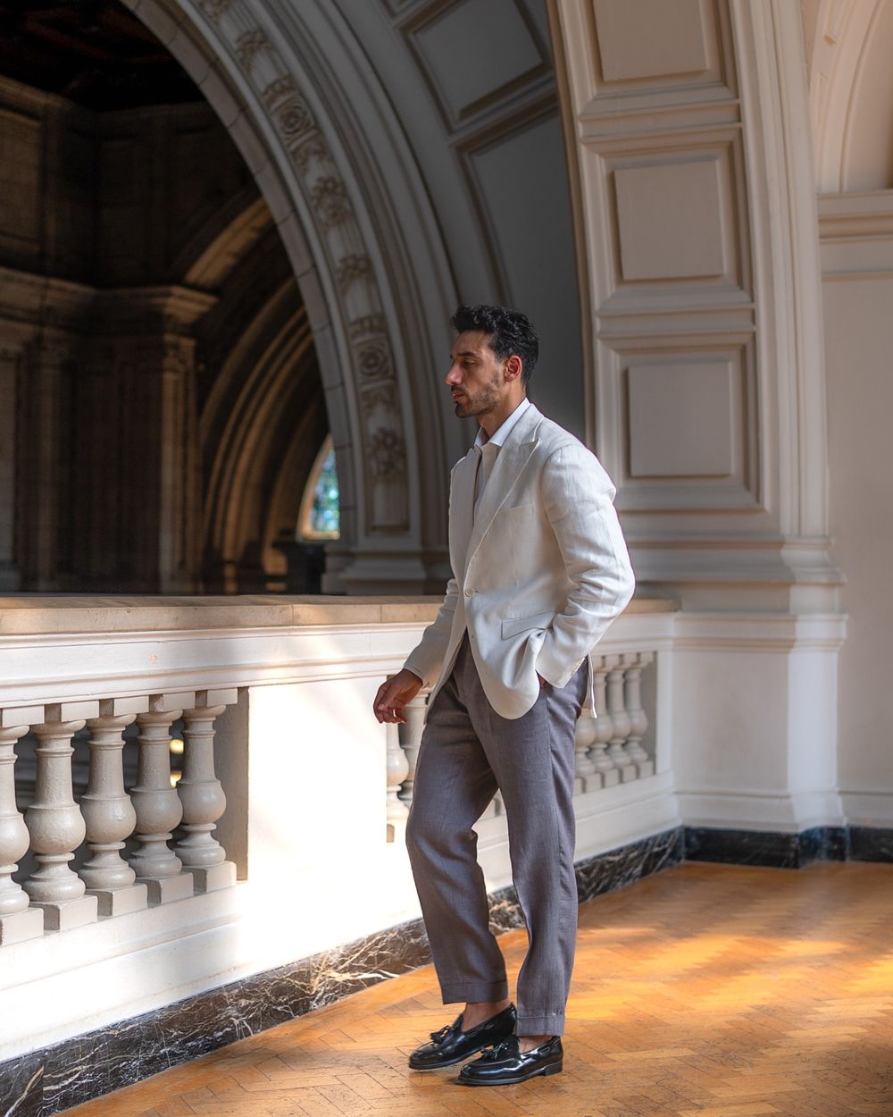White Blazer with Gray Trousers and Tassel Loafers