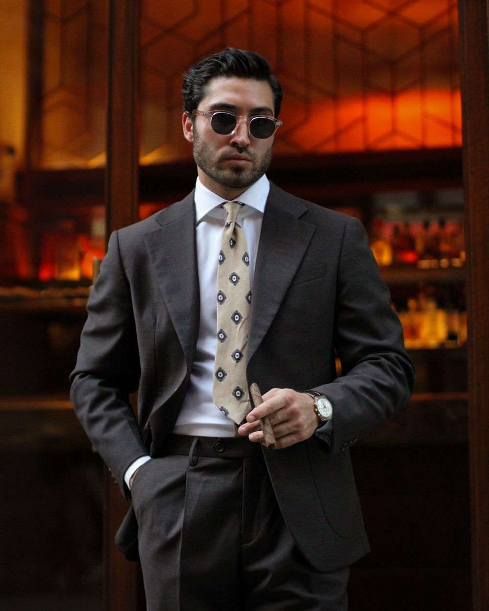 Brown Suit with White Shirt and Patterned Tie