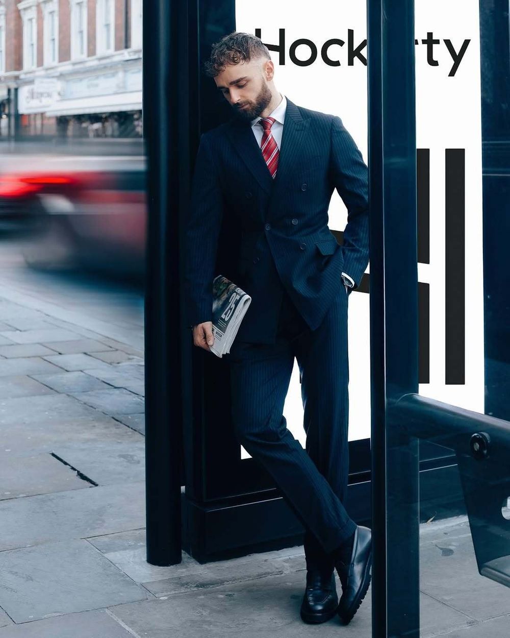 Navy Pinstriped Double-Breasted Suit with Red Striped Tie