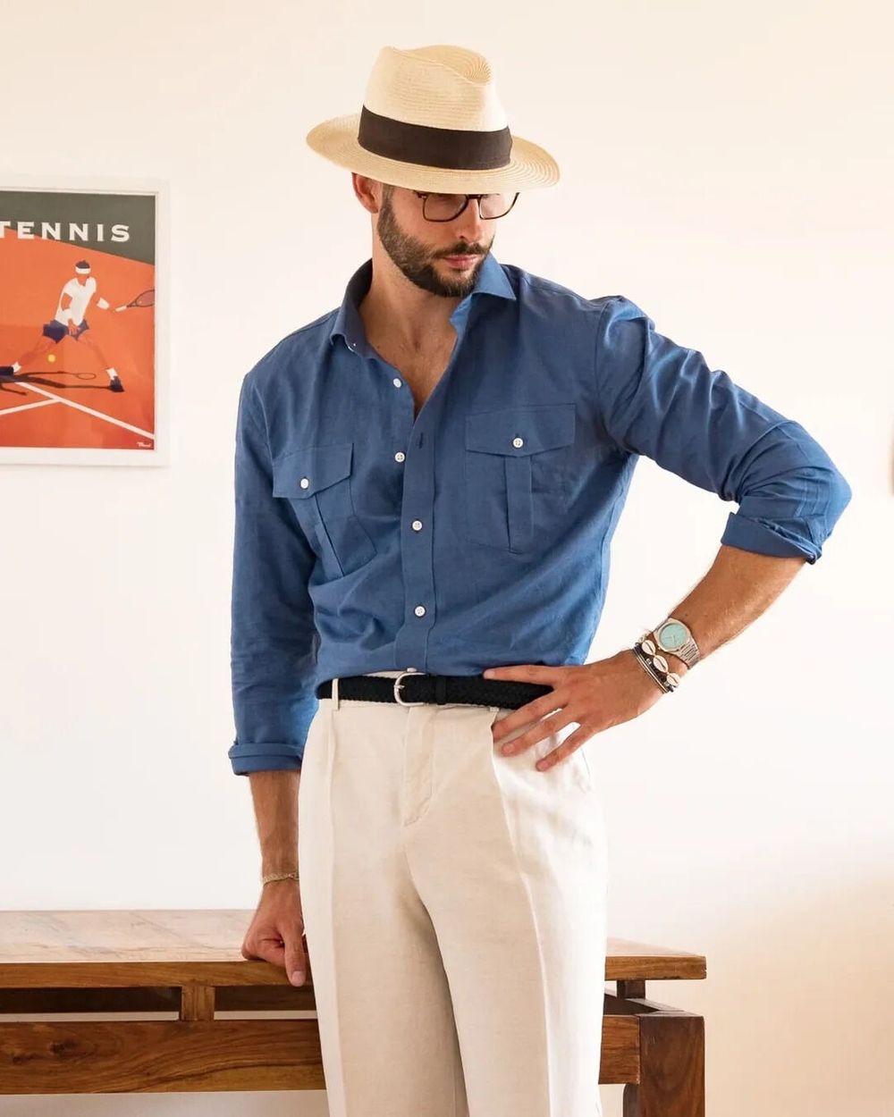 Blue Button-Up Shirt with White Trousers and Panama Hat