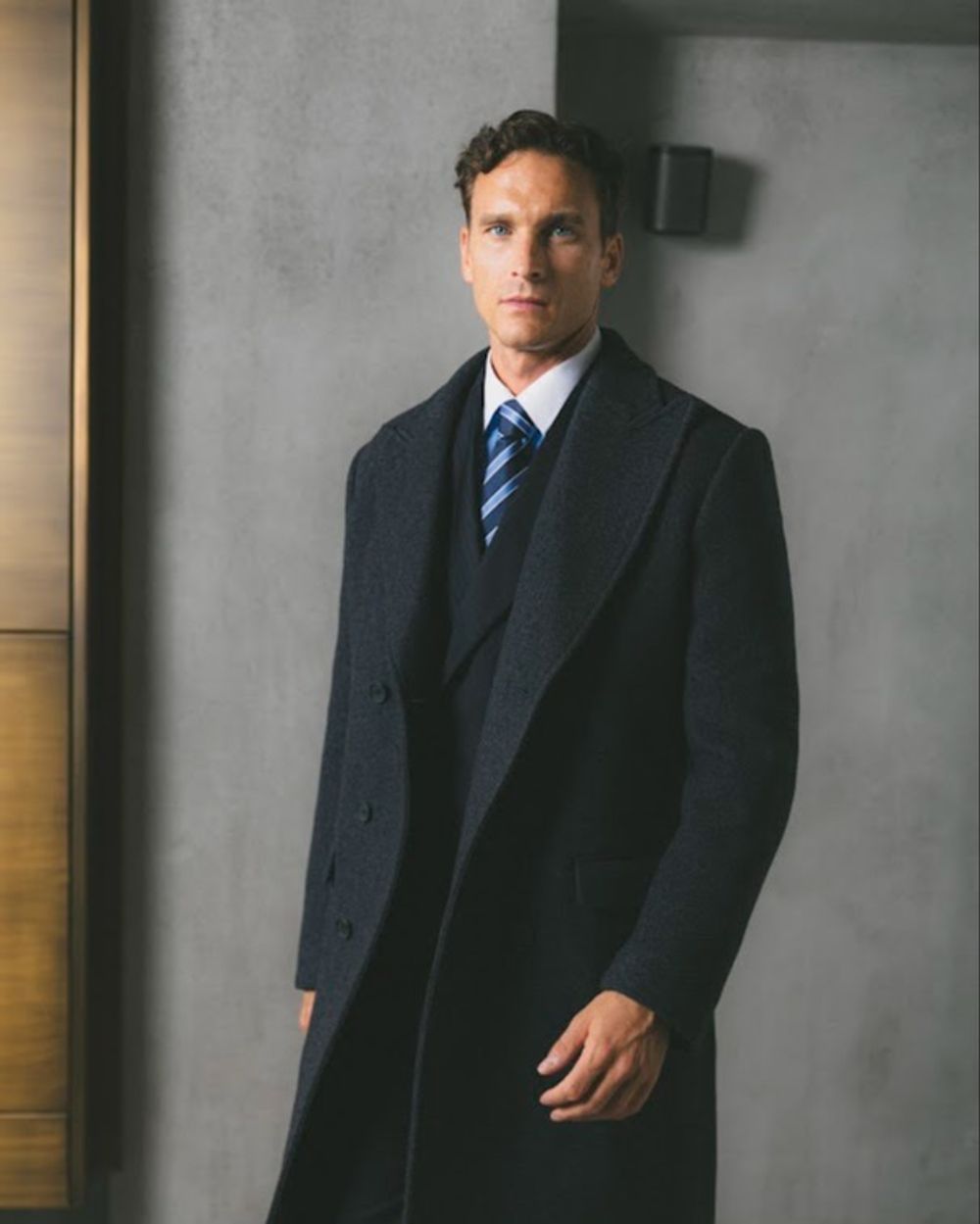 Dark Navy Overcoat with Three-Piece Suit and Striped Tie