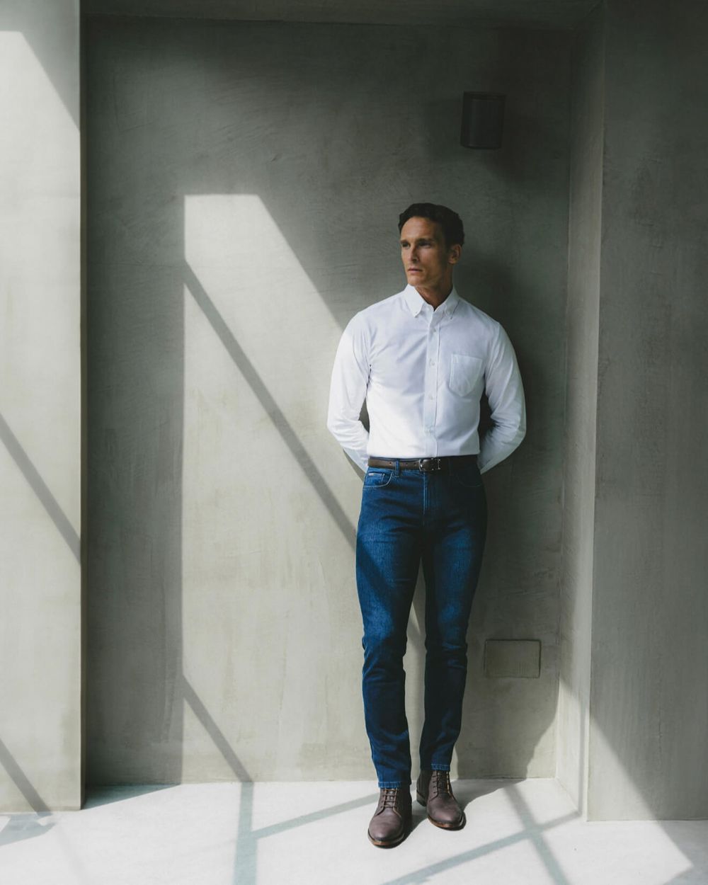 White Button-Up Shirt with Dark Blue Jeans