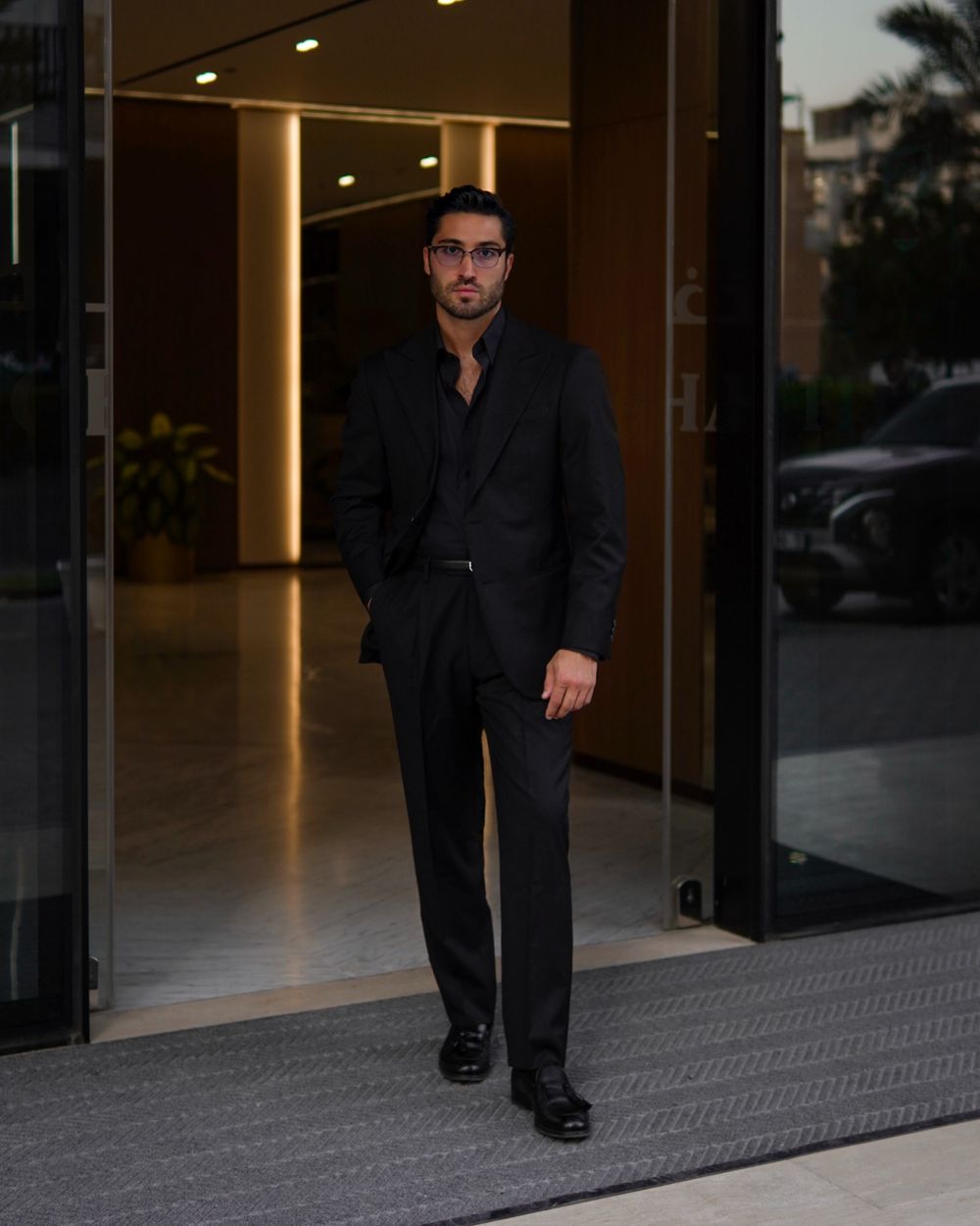 All-Black Tailored Suit with Open-Collar Shirt