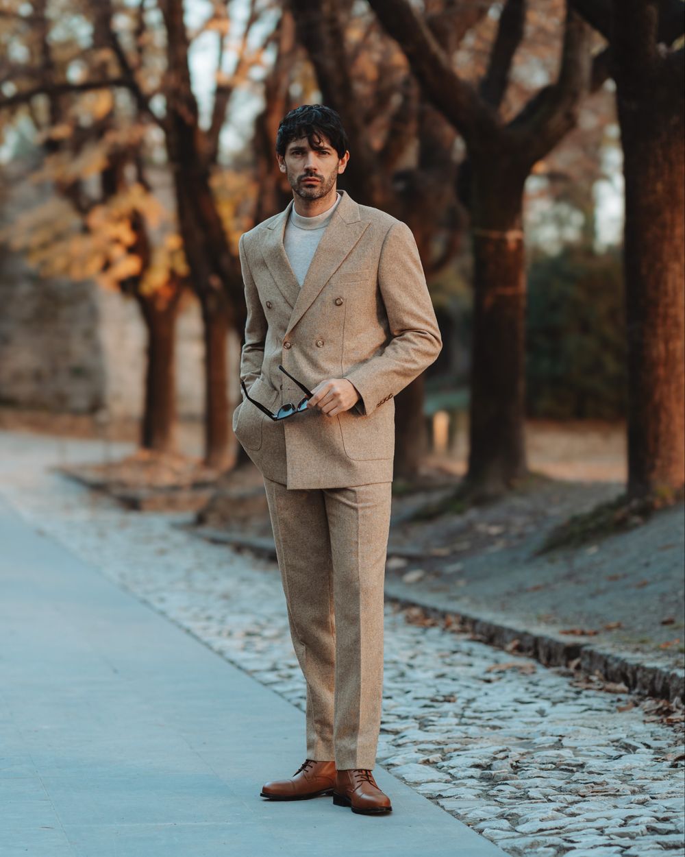 Beige Suit with Gray Knit and Brown Derby Shoes