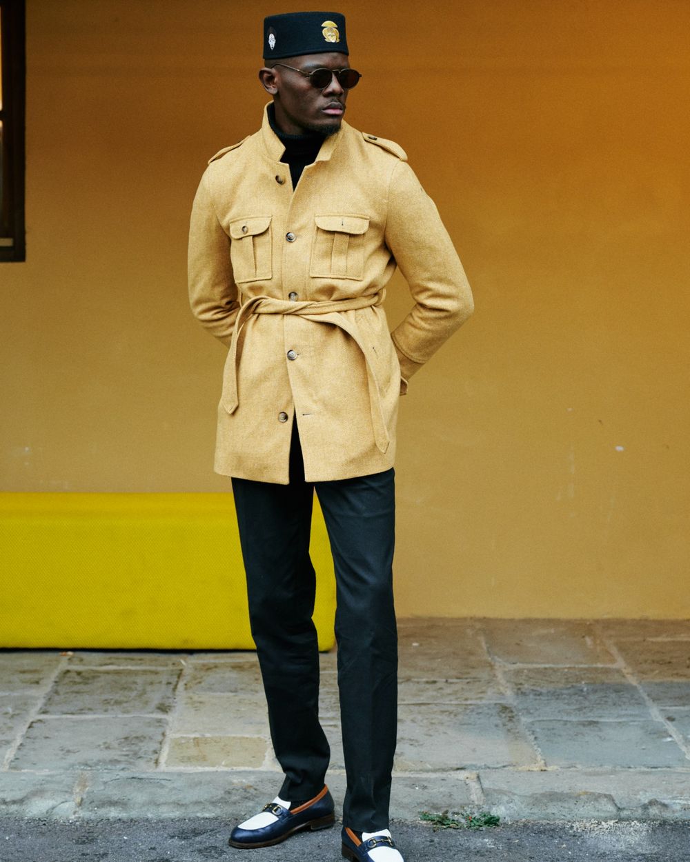 Mustard Belted Safari Jacket with Black Turtleneck and Black Trousers