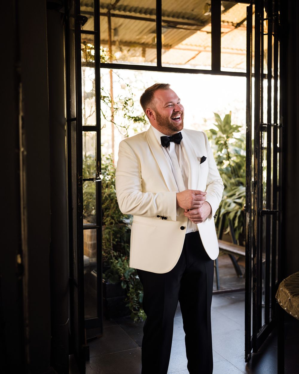 Ivory Dinner Jacket with Black Trousers and Black Bow Tie