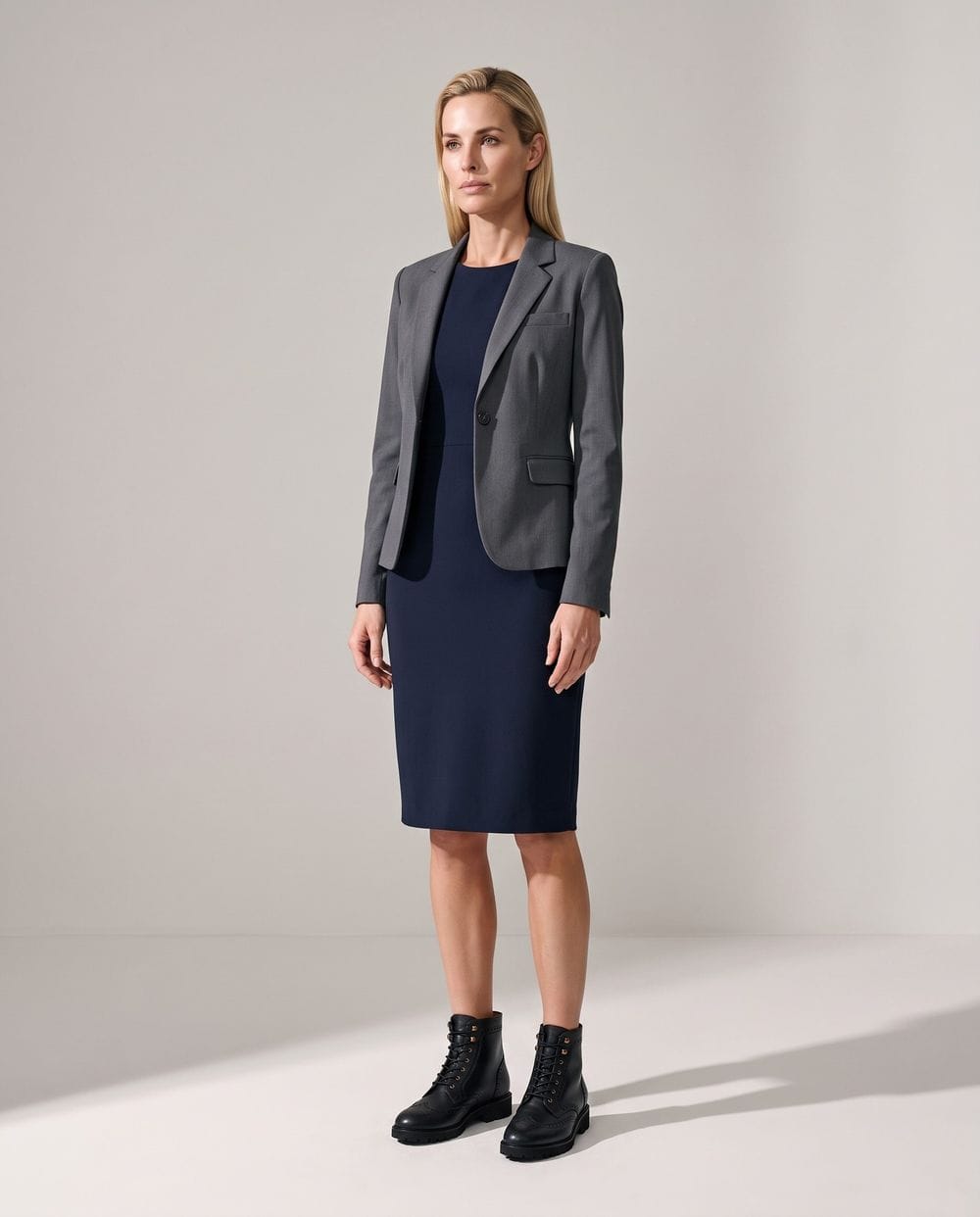 Work Dress Outfit: Navy Dress, Gray Jacket and Black Boots