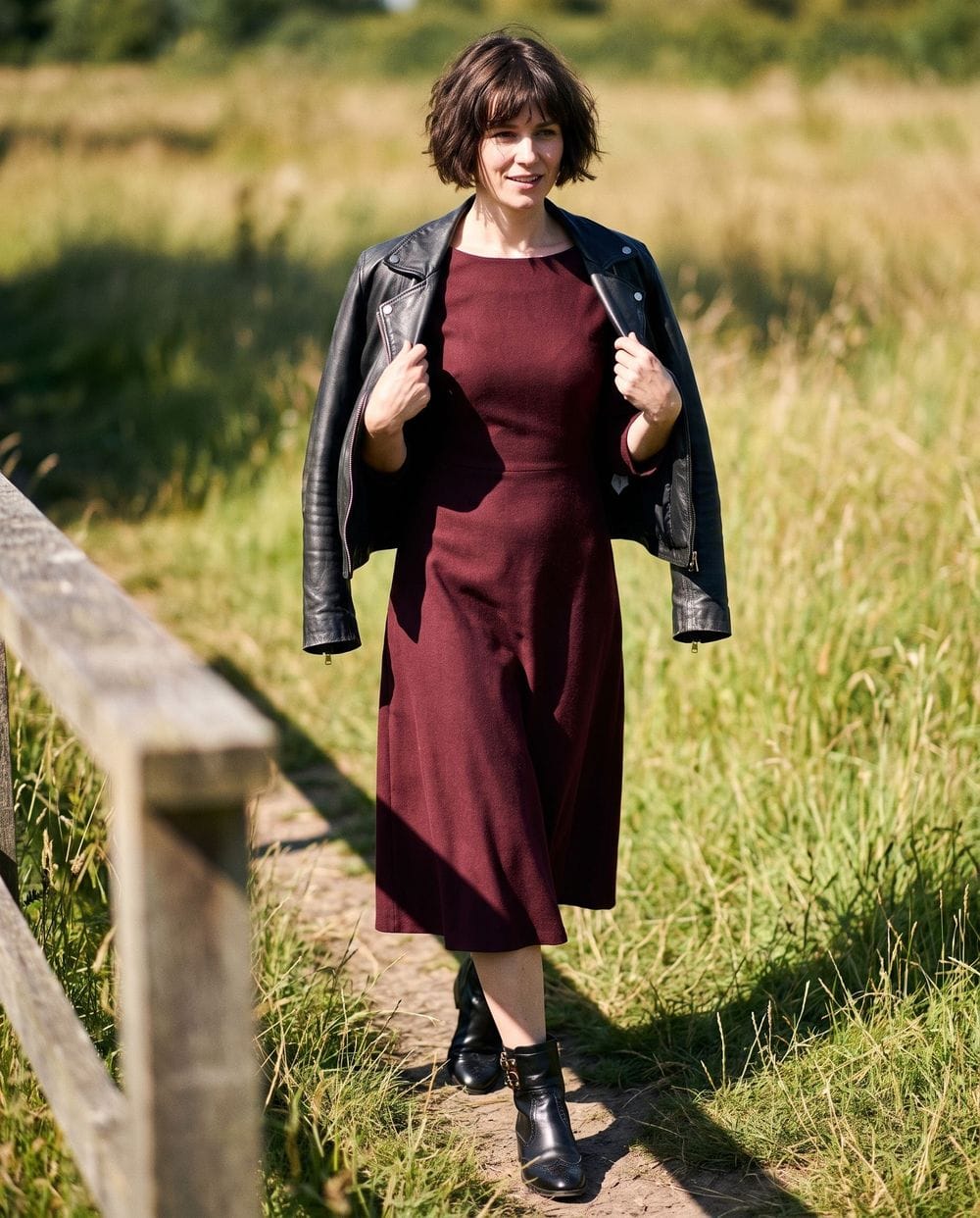 Leather Jacket over a Burgundy Midi Dress with Black Boots