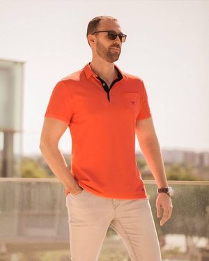 Coral Polo Shirt and beige chino pants