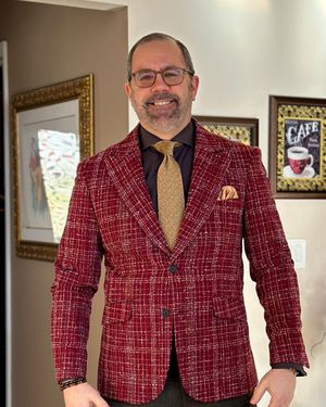 Red Houndstooth Blazer with Brown Trousers