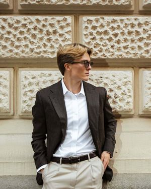 Charcoal Blazer with Crisp White Shirt and Beige Trousers