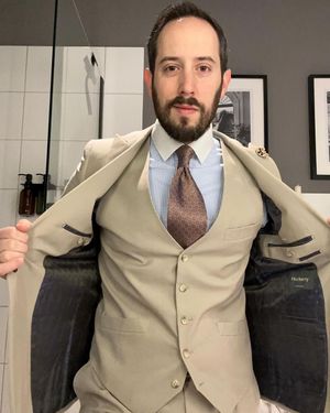 Beige Three-Piece Suit with Checked Shirt and Patterned Tie