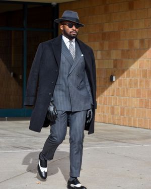 Pinstripe Suit with Black Overcoat