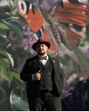 dapper-dark-green-suit-bow-tie-classic-hat
