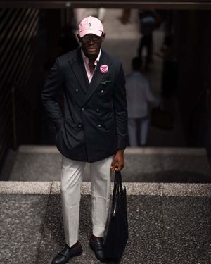 Pinstriped Navy Double-Breasted Blazer with White Trousers