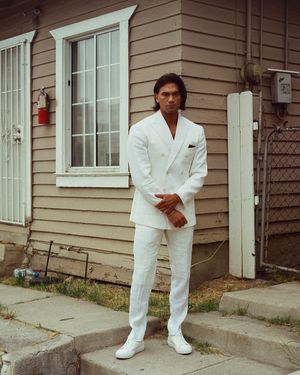 White Double-Breasted Suit with White Trainers