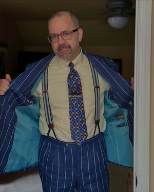 Navy Pinstriped Suit with Yellow Shirt and Geometric Tie