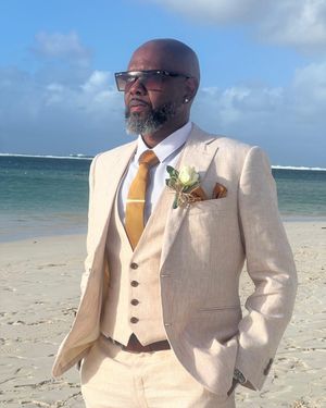 ivory-linen-three-piece-suit-white-shirt-mustard-tie