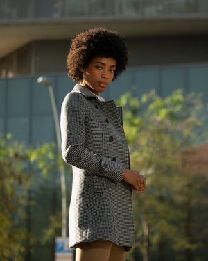 grey-checked-coat-with-brown-trousers