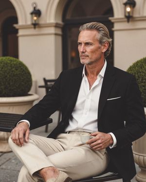 Black Blazer with White Shirt and Cream Chinos