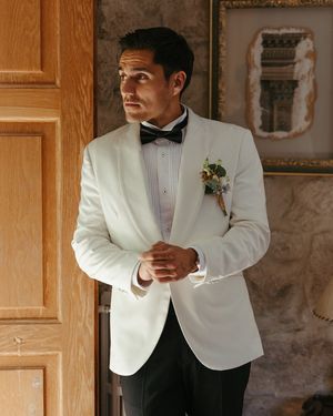white-tuxedo-jacket-black-trousers-bow-tie