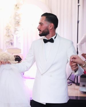 white-double-breasted-tuxedo-jacket-black-trousers