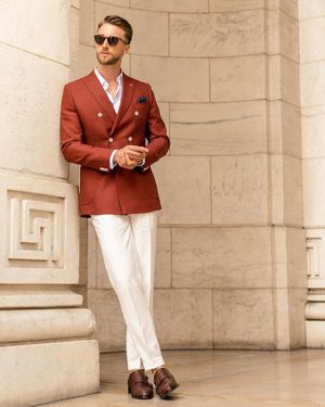 Terracotta linen double breasted blazer with ivory pants and double buckle monk shoes from