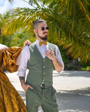 sage-green-waistcoat-white-shirt-mustard-bow-tie