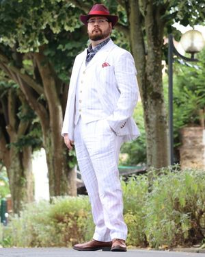 White Pinstriped Three-Piece Suit with Burgundy Hat