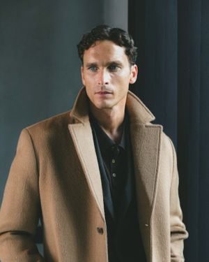Camel Overcoat with Black Suit and Polo Shirt