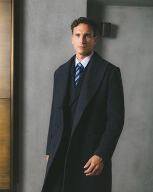 dark-navy-overcoat-three-piece-suit-striped-tie