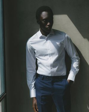 Striped Button-Up Shirt with Navy Trousers