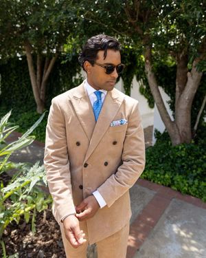 sand-double-breasted-suit-white-shirt-blue-tie