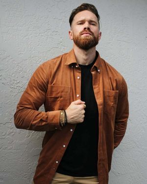 Camel Corduroy Overshirt with Black T-Shirt and Tan Trousers
