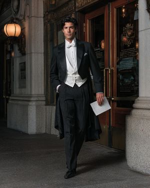 Classic Black Tailcoat with Ivory Waistcoat and Striped Trousers